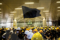 Hong Kongers storm the Legislature, Police retaliate with tear gas