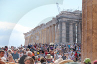 Tourist At Acropolis Hill And Parthenon In Athens 