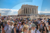 Tourist At Acropolis Hill And Parthenon In Athens 