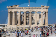 Tourist At Acropolis Hill And Parthenon In Athens 