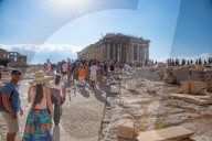 Tourist At Acropolis Hill And Parthenon In Athens 