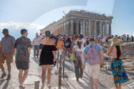 Tourist At Acropolis Hill And Parthenon In Athens 