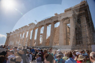 Tourist At Acropolis Hill And Parthenon In Athens 