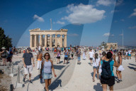 Tourist At Acropolis Hill And Parthenon In Athens 