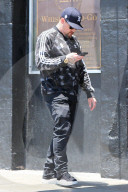 Benji Madden is seen busy on his phone as he is running errands in Los Angeles.