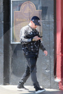 Benji Madden is seen busy on his phone as he is running errands in Los Angeles.