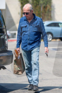 Paul Hogan, 79, is seen leaving Whole Foods grocery store in Los Angeles.