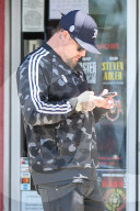 Benji Madden is seen busy on his phone as he is running errands in Los Angeles.