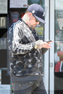 Benji Madden is seen busy on his phone as he is running errands in Los Angeles.