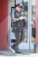 Benji Madden is seen busy on his phone as he is running errands in Los Angeles.