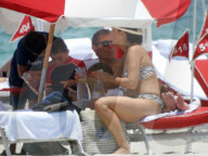 Original member of English pop band Duran Duran, Roger Taylor, was pictured enjoying a beach day in Miami Beach with his beautiful wife, Peruvian national Gisella Bernales, and their adorable 8-year-old son Julian Roger. 