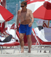 Original member of English pop band Duran Duran, Roger Taylor, was pictured enjoying a beach day in Miami Beach with his beautiful wife, Peruvian national Gisella Bernales, and their adorable 8-year-old son Julian Roger. 