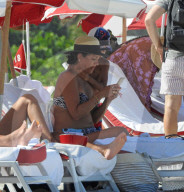 Original member of English pop band Duran Duran, Roger Taylor, was pictured enjoying a beach day in Miami Beach with his beautiful wife, Peruvian national Gisella Bernales, and their adorable 8-year-old son Julian Roger. 