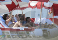 Original member of English pop band Duran Duran, Roger Taylor, was pictured enjoying a beach day in Miami Beach with his beautiful wife, Peruvian national Gisella Bernales, and their adorable 8-year-old son Julian Roger. 