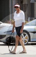 Caitlyn Jenner, 69, takes a solo stroll to her local Malibu supermarket on the day her partner Sophia Hutchins, 22, held business meetings in New York City. 