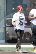 Blac Chyna looks fresh-faced and happy as she emerges from a four-hour visit to a laser center in LA. 