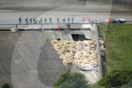 Disaster tourism arrives in Whaley Bridge after dam incident. Busloads of Chinese tourists and surge of UK visitors boost local businesses in town post evacuation.

