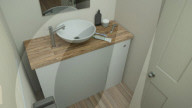 FEATURE - Klapptoilette macht das Beste aus begrenztem Platz im kleinsten Raum des Hauses