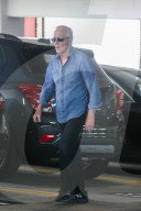 Paul Hogan is seen whistling as he leaves a medical building in Los Angeles.
