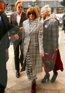 Anna Wintour Is Chic In Plaid Overcoat At PFW Before Turning 70 Next Month