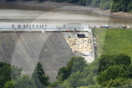 Disaster tourism arrives in Whaley Bridge after dam incident. Busloads of Chinese tourists and surge of UK visitors boost local businesses in town post evacuation.
