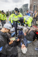Climate change activists from the Extinction Rebellion start a couple of weeks actions around the Houses of Parliament. They block and occupy roads around the Parliament and some chain themselves to a truck outside the Home Office.