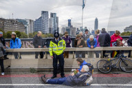 Climate change activists from the Extinction Rebellion start a couple of weeks actions around the Houses of Parliament. They block and occupy roads around the Parliament and some chain themselves to a truck outside the Home Office.