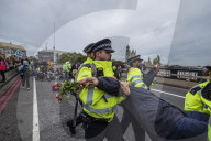 Climate change activists from the Extinction Rebellion start a couple of weeks actions around the Houses of Parliament. They block and occupy roads around the Parliament and some chain themselves to a truck outside the Home Office.