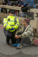 Climate change activists from the Extinction Rebellion start a couple of weeks actions around the Houses of Parliament. They block and occupy roads around the Parliament and some chain themselves to a truck outside the Home Office.