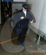 PREMIUM EXCLUSIVE Taron Egerton of 'Rocketman' Maintains Low Profile At LAX