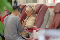 Gwen Stefani chills out gum and blows bubbles as she gets her nails done in Beverly Hills.