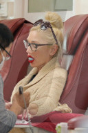Gwen Stefani chills out gum and blows bubbles as she gets her nails done in Beverly Hills.