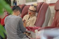 Gwen Stefani chills out gum and blows bubbles as she gets her nails done in Beverly Hills.