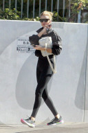 Rosie Huntington-Whiteley flaunts her sensational figure as she leaves a gym in LA. 