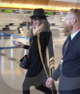 PREMIUM EXCLUSIVE Naomi Campbell Enjoys A Smoke Before Catching A Flight At LAX
