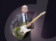 Francis Rossi of Status Quo with his famous green Fender Telecaster guitar .