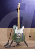 Francis Rossi of Status Quo with his famous green Fender Telecaster guitar .