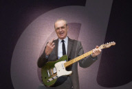 Francis Rossi of Status Quo with his famous green Fender Telecaster guitar .