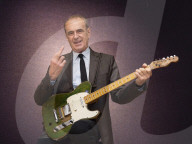 Francis Rossi of Status Quo with his famous green Fender Telecaster guitar .