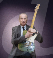 Francis Rossi of Status Quo with his famous green Fender Telecaster guitar .