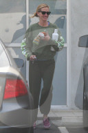 A dressed-down Julia Roberts is all smiles as she shares a joke with a female friend on her way from a Pilates class in Malibu.