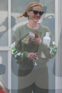 A dressed-down Julia Roberts is all smiles as she shares a joke with a female friend on her way from a Pilates class in Malibu.