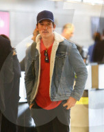 Hollywood actor Miles Teller and his model wife of two months, Keleigh Sperry, are deep in conversation as they catch a flight out of LAX. 