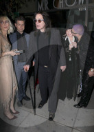 PREMIUM EXCLUSIVE Shasron Osbourne Looks Super Uncomfortable As Family Friend Plants A Kiss On Her Cheek