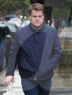 PREMIUM EXCLUSIVE Grumpy James Corden Braves The Rain For His Morning Coffee