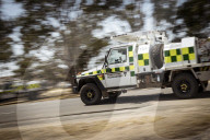 Storms have brought heavy rain to fire-hit regions of eastern Australia - but authorities warn the nation's bushfire crisis is still "far from over" as another fire breaks out in Canberra.
