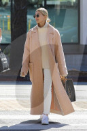 Hailey Baldwin in large beige coat