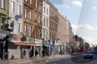 Kilburn is a down-to-earth multicultural district centred on busy Kilburn High Road, which is lined with mainstream stores, traditional pubs, and chain burger bars. Chinese, African, and Caribbean eateries serve the local community.