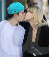 Justin Bieber And Hailey Baldwin Engage In Steamy Smooch Session For The Cameras