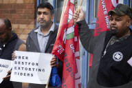 Striking Uber drivers outside the Uber offices in Birmingham